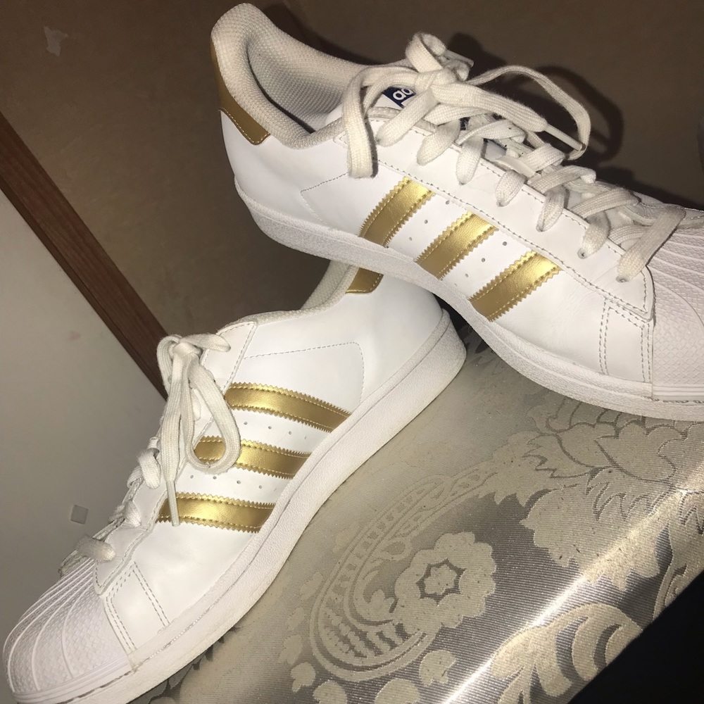 Gold and white Adidas